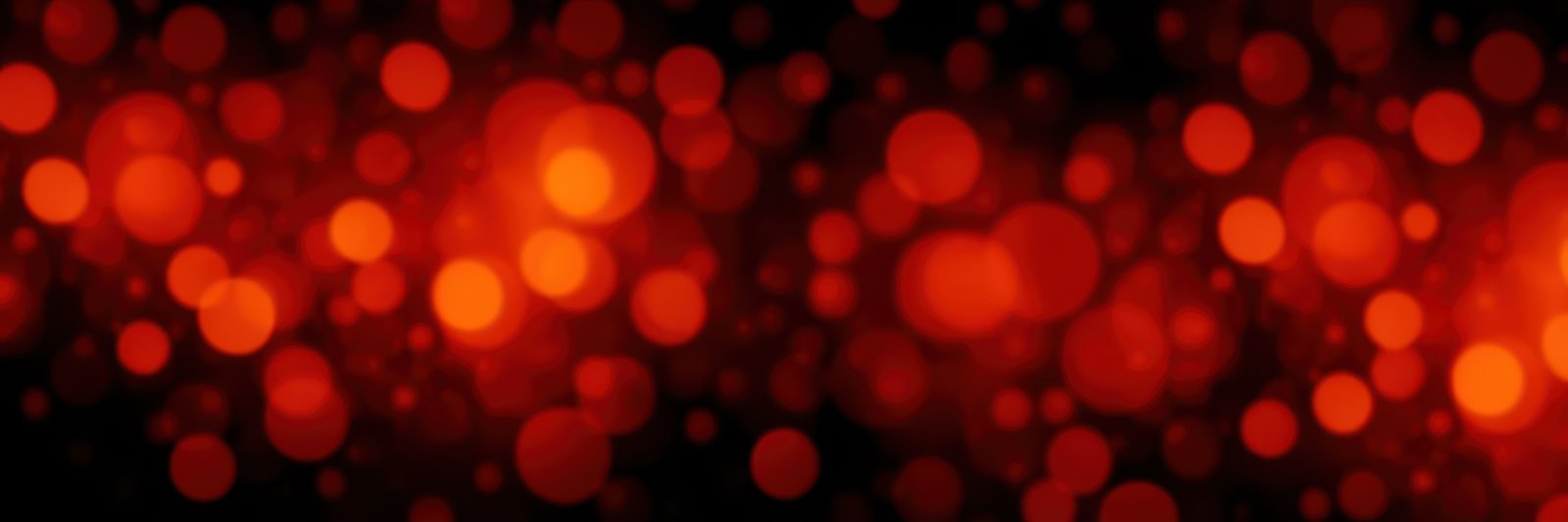 Vibrant red bokeh lights create a warm and inviting atmosphere during a nighttime celebration